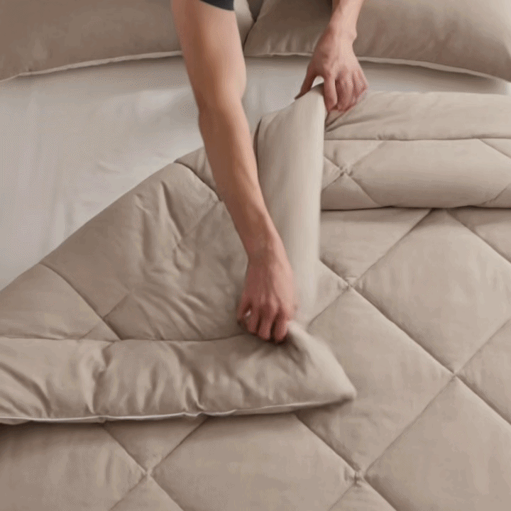 Demonstration of how easily an all-in-one coverless duvet can be arranged on a bed